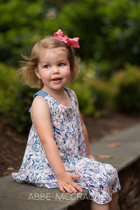 Portrait of a 3-year-old girl with the wind blowing in her hair