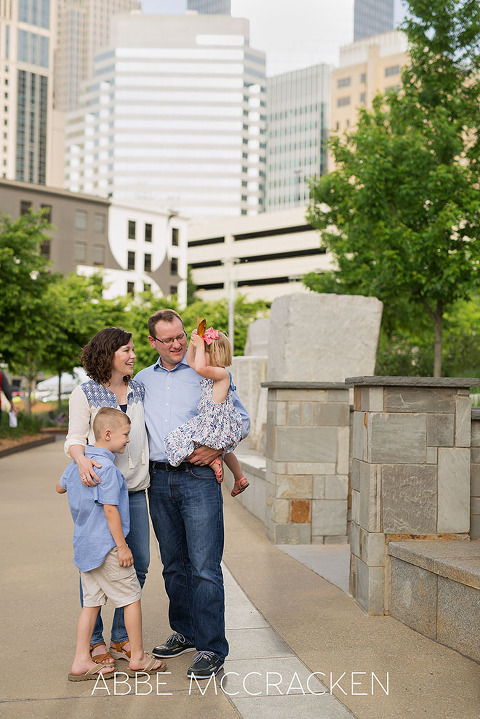 Candid family portrait at Romare Bearden Park in uptown Charlotte