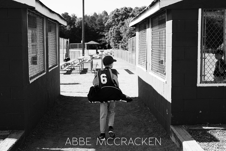 Youth Baseball Photography - South Charlotte Recreation Association - young boy walking to his dugout
