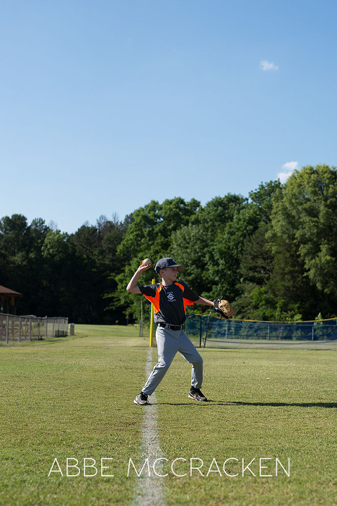 Youth Baseball Photography of a young boy in South Charlotte Recreation Association machine pitch league warming up
