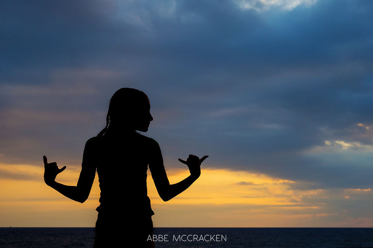 vacation photos - colorful silhouette of Charlotte photographer Abbe McCracken's daughter enjoying a Big Island, HI sunset