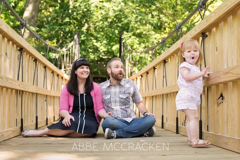 candid family pictures in Charlotte's Freedom Park with a two year old