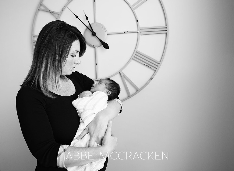 Black and white portrait of a mother and newborn son