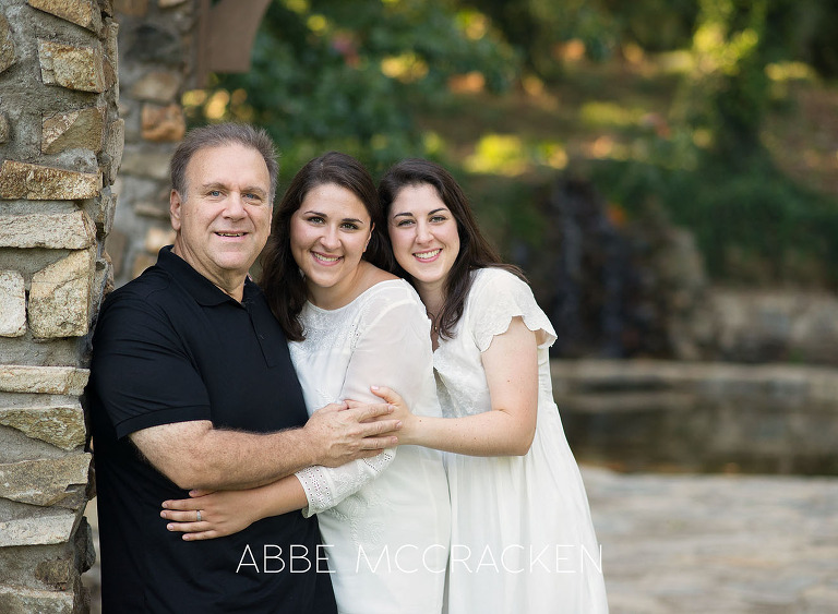 Family photos with adult, older children in Charlotte's Independence Park