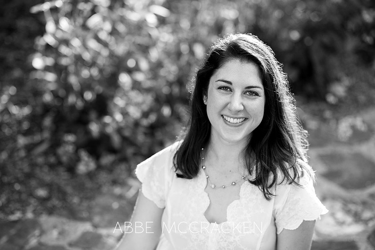Black and white headshot of adult daughter with gorgeous backlighting, taken during a family photography session