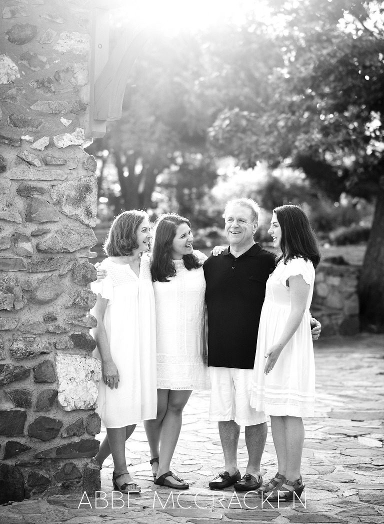 Gorgeous black and white candid family photo with adult children in Independence Park
