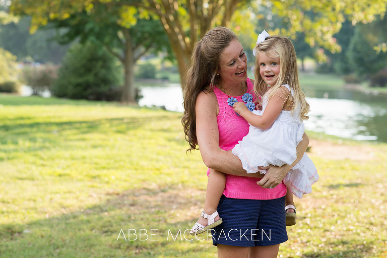Candid mother and daughter moment in Charlotte's Freedom Park