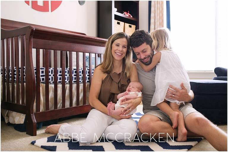 Newborn lifestyle photography session - family portrait in the nursery