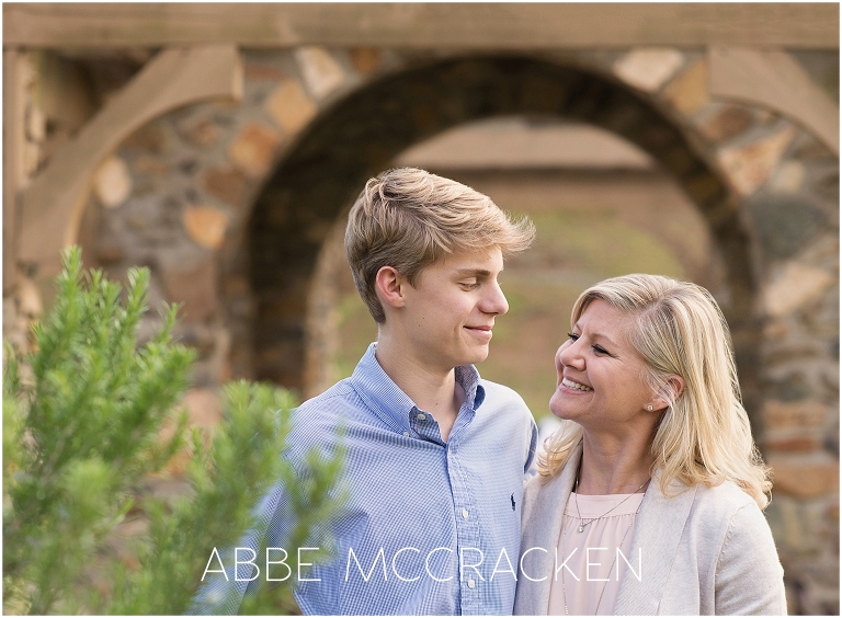 Mother and middle son enjoy a quiet moment during a family photography session in Charlotte's Independence Park