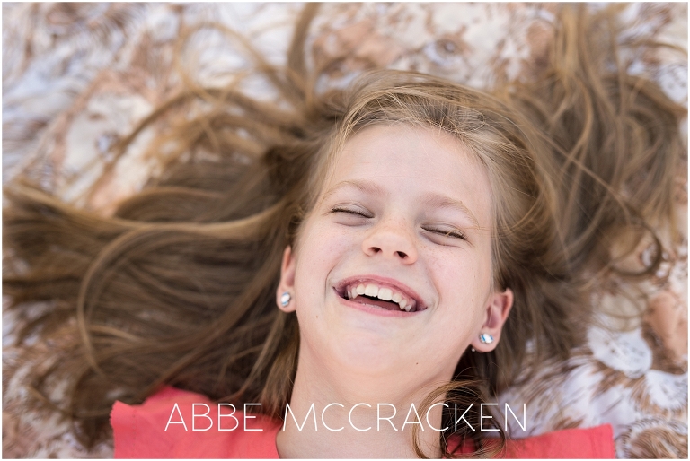 Image of a girl laughing, gorgeous smile full of joy