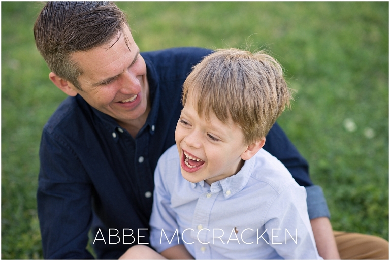 Joyful picture of father and son laughing