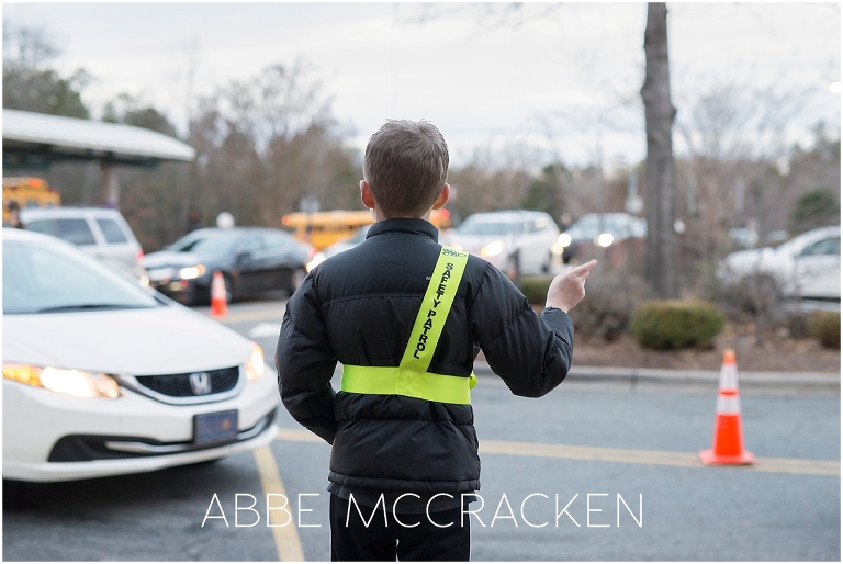 Young boy on Safety Patrol duty at school