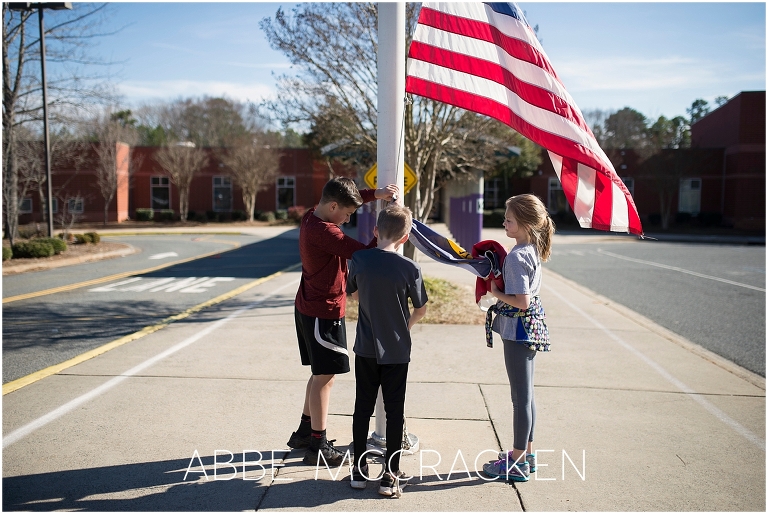 School children taking down flags