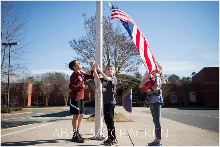 School children taking down flags