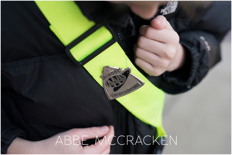 Child admiring his Safety Patrol badge