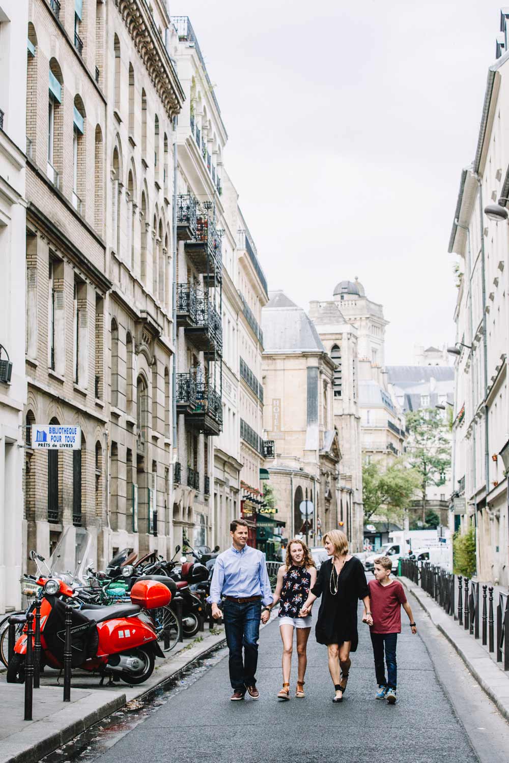 Abbe and her family walking the streets of Paris