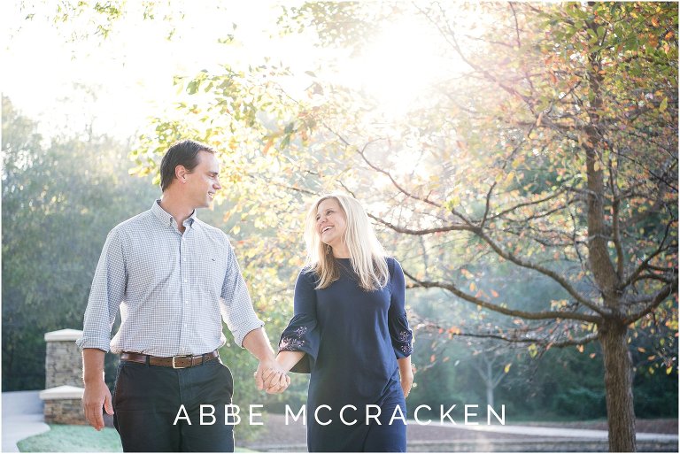 Candid image of a husband and wife walking in Charlotte's Freedom Park