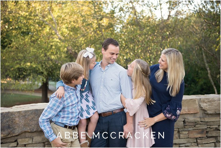 Candid family portrait from a fall photo session in Charlotte's Freedom Park