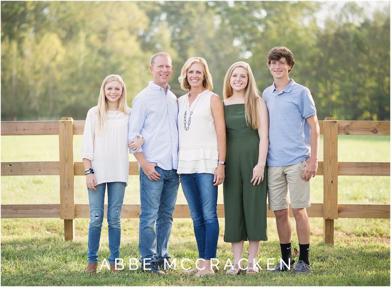 Family portrait with teenagers on the family farm in Waxhaw