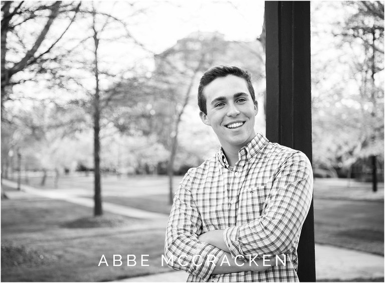 Candid senior portrait of guy laughing