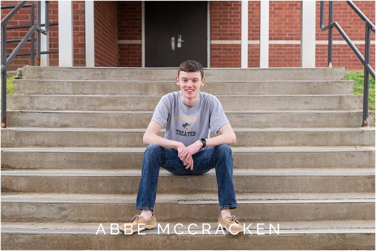 Senior portrait in one of the outdoor corridors on the campus of Providence High School