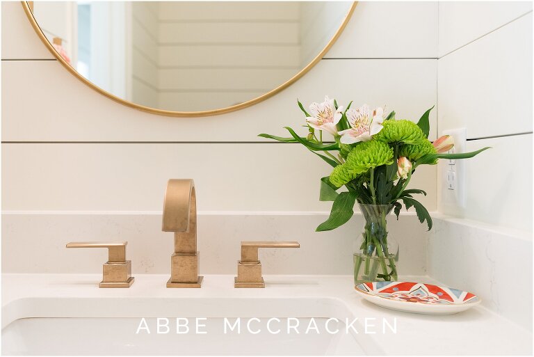 Gorgeous details in lake house powder room - interior design by The Warrick Co.