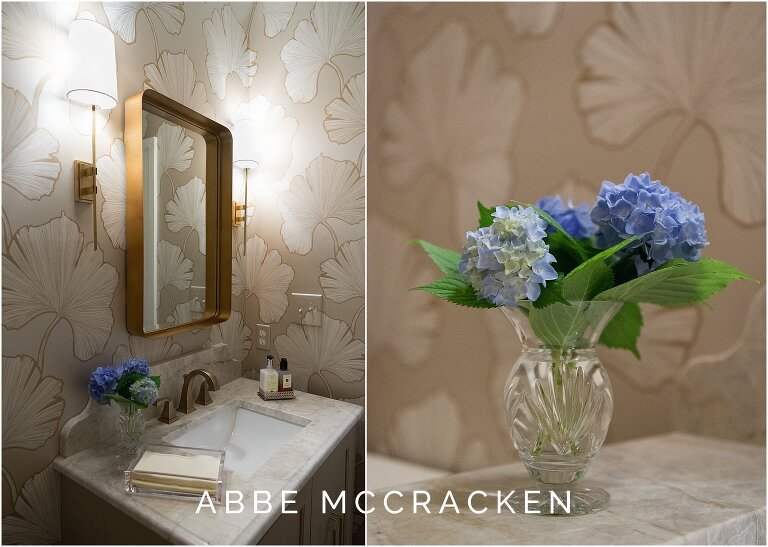 Bold, modern wallpaper in neutral guest bath, blue hydrangeas offer a pop of color