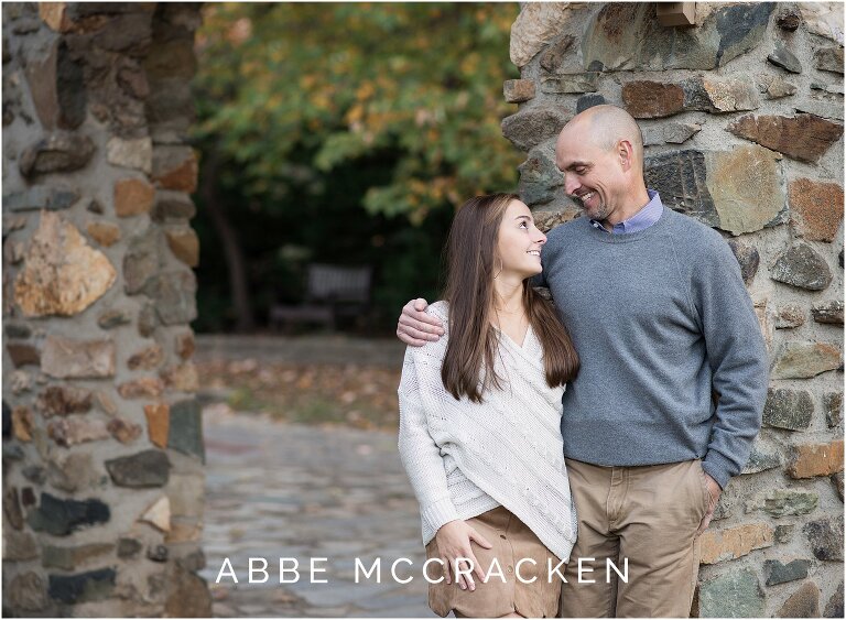 Candid picture of father laughing at his high school senior daughter