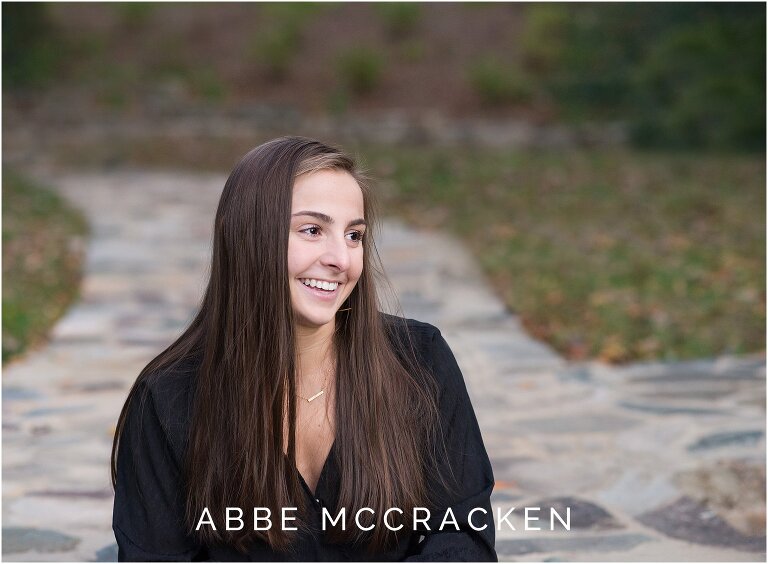 Candid senior portrait of high school girl laughing