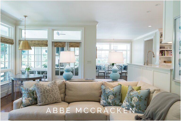 Interior design photography showing overview of how family room, kitchen and porch flow together