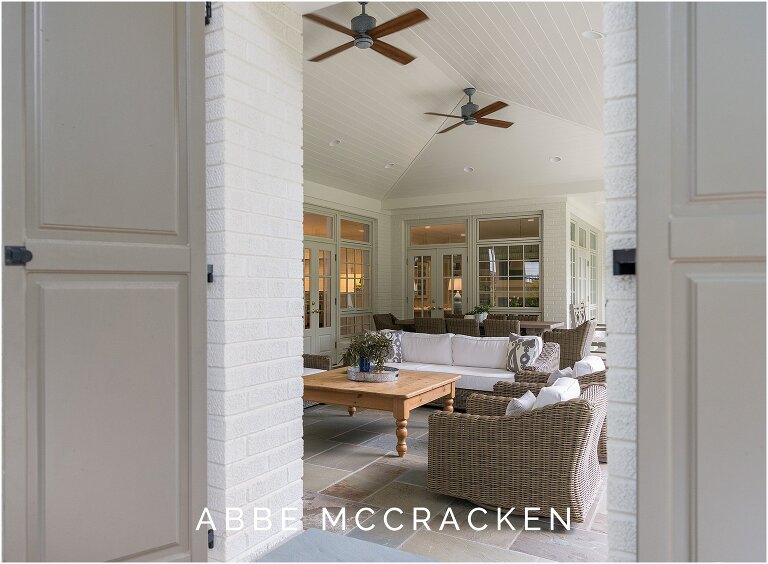 Cozy neutral fabrics on exterior cover porch