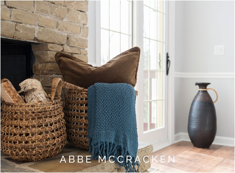 cozy great room details including baskets, pillows and throws