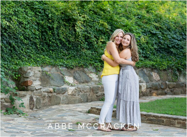 Mother and senior daughter hugging