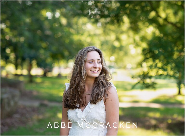 Senior portrait with gorgeous bokeh from the surrounding park