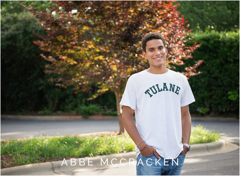 Senior guy showing off his Tulane University shirt