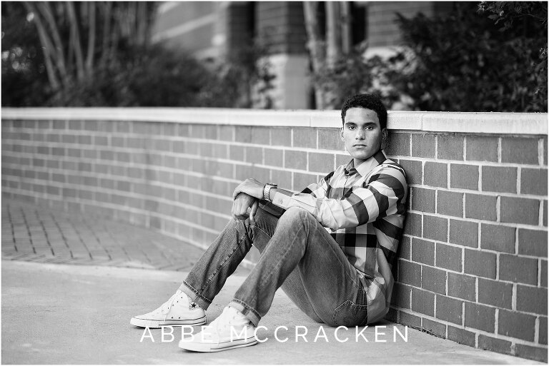 Casual black and white senior portrait of a guy