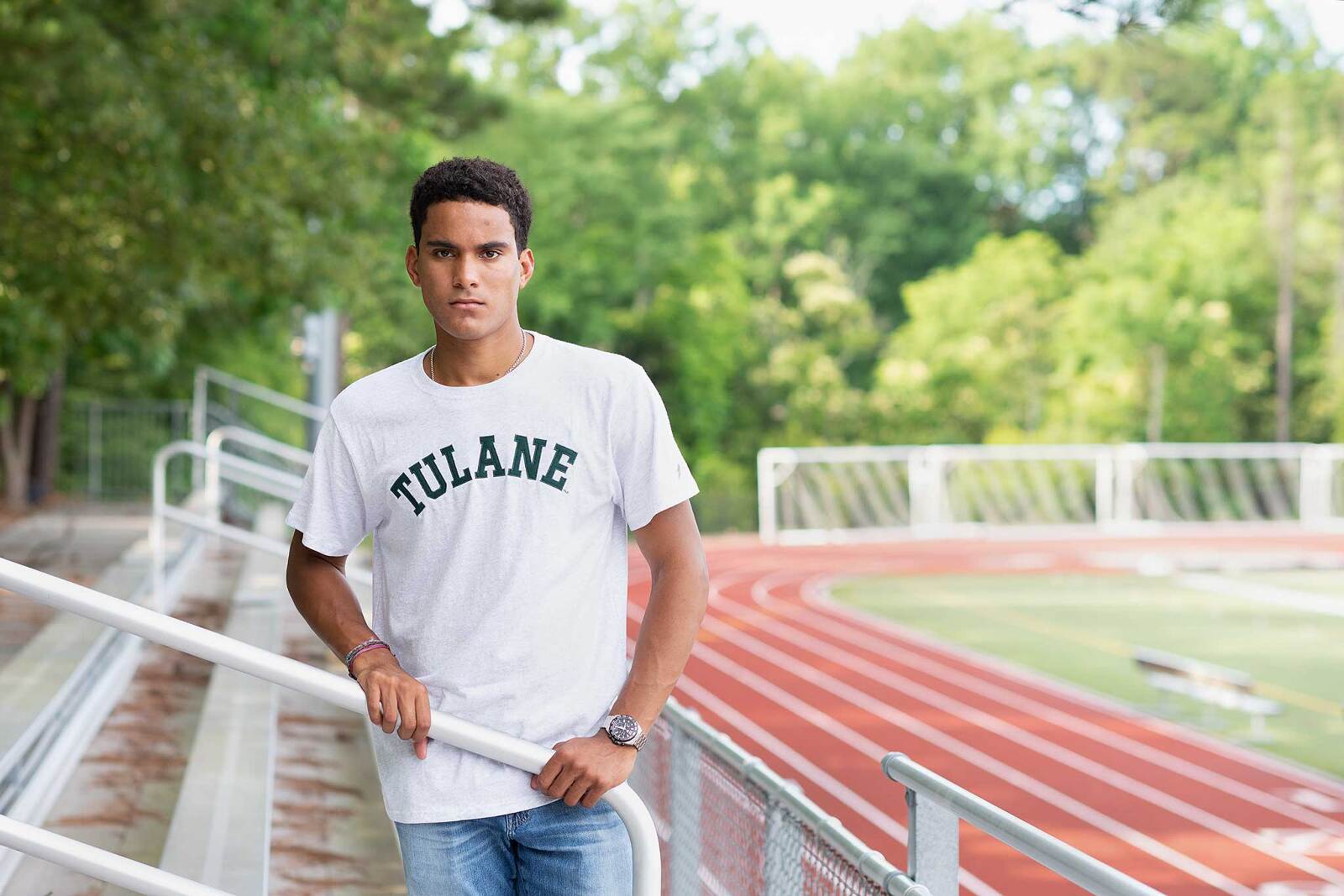 Senior guy wearing his college t-shirt for senior portraits in Charlotte NC