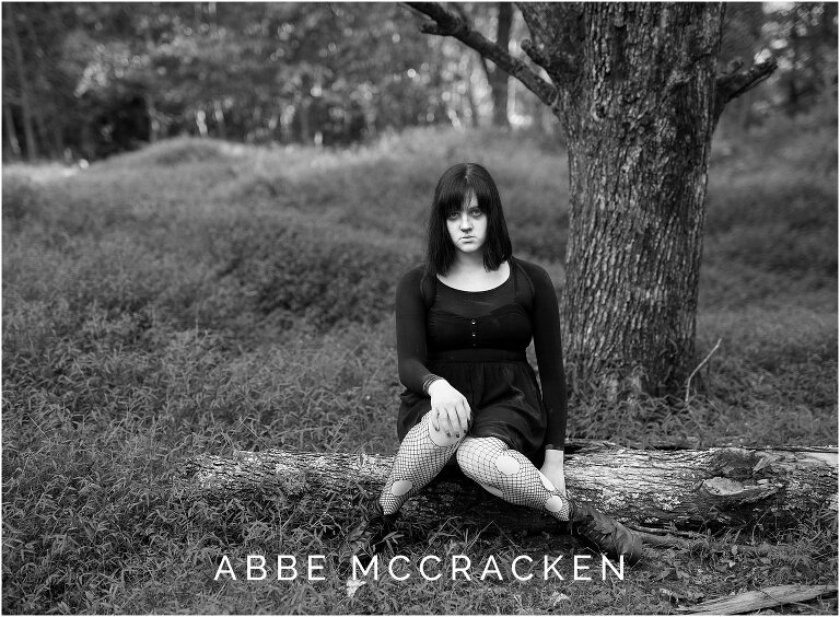 image in a forest of teenage girl dressed as ghost