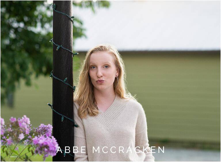 Funny candid senior portrait of a blond girl