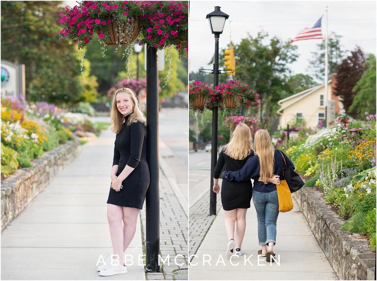 Summer senior portraits with flowers in downtown Blowing Rock; sisters walking together