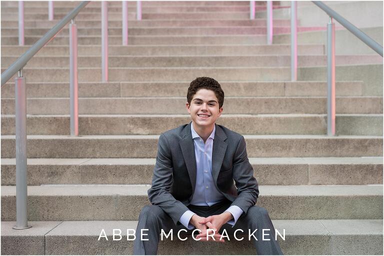 High school senior in gray suit and blue shirt