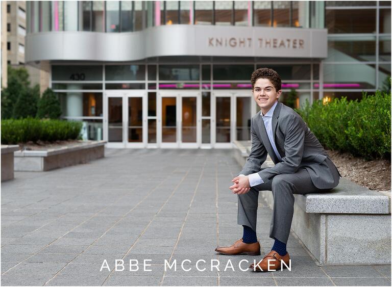 Senior portrait in front of Charlotte's Knight Theater