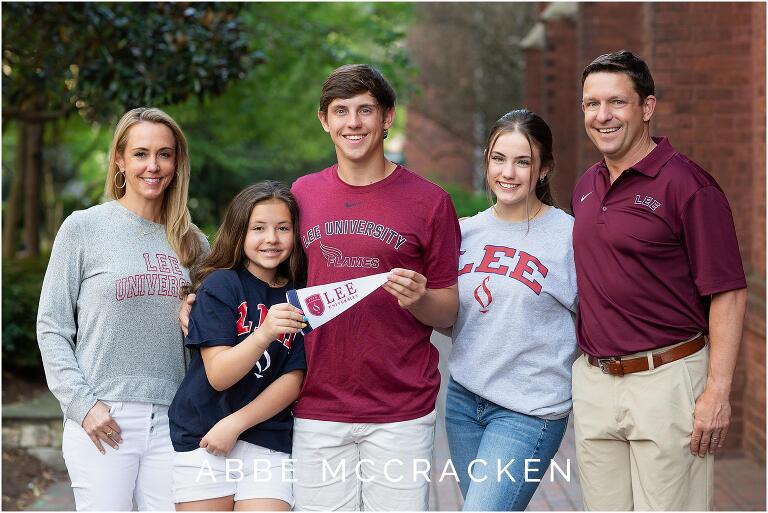 Family portrait with a high school senior celebrating his college choice: Lee University