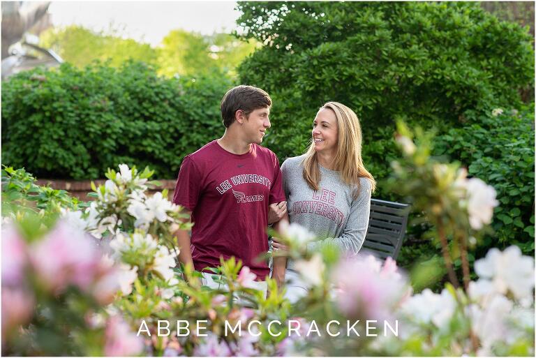 high school senior son walking and laughing with his mother in Charlotte's Romare Bearden Park