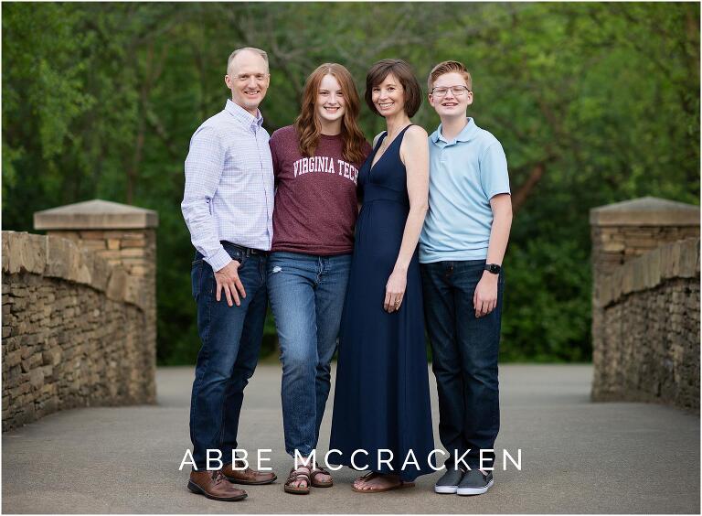 Family standing with senior in her college t-shirt