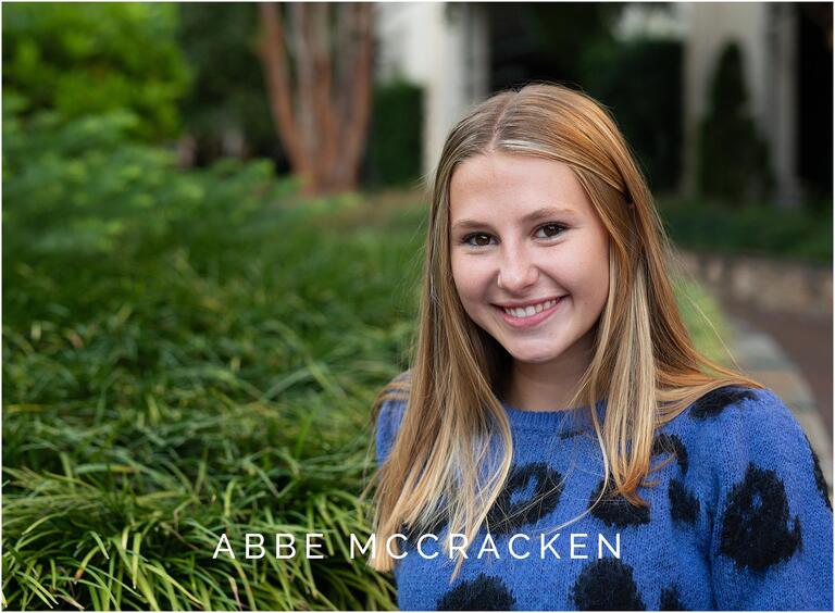 Senior portrait with greenery shot in Uptown Charlotte NC