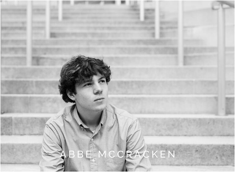 Black and white urban senior portrait of a high school boy