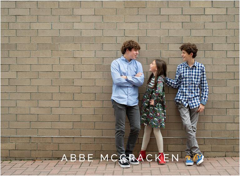 Urban portrait of siblings talking candidly to each other.