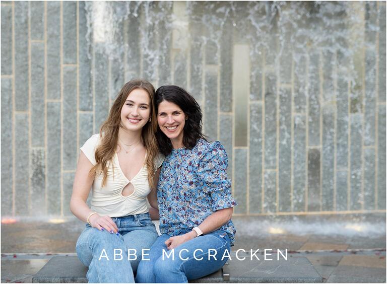 mother and daughter in front of the waterfall at Romare Bearden Park