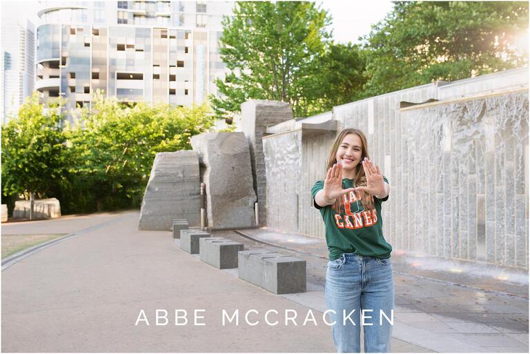 High school senior portrait of girl in her University of Miami t-shirt